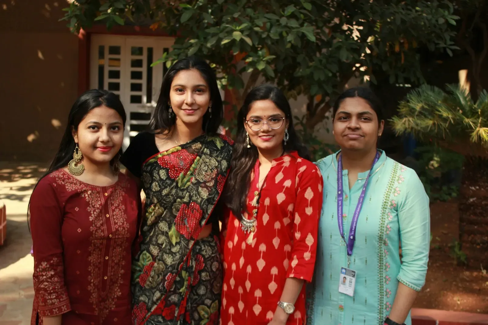 Team members in festive clothes posing together