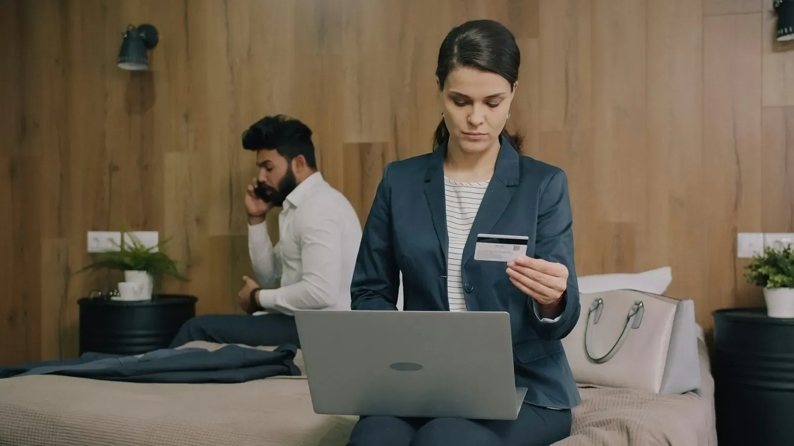 Woman entering card details on a laptop while shopping online