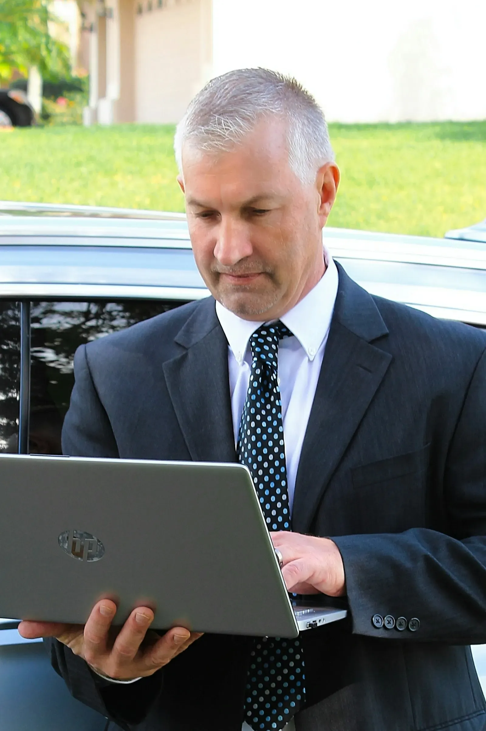 Advisor reviewing a cited answer on his laptop