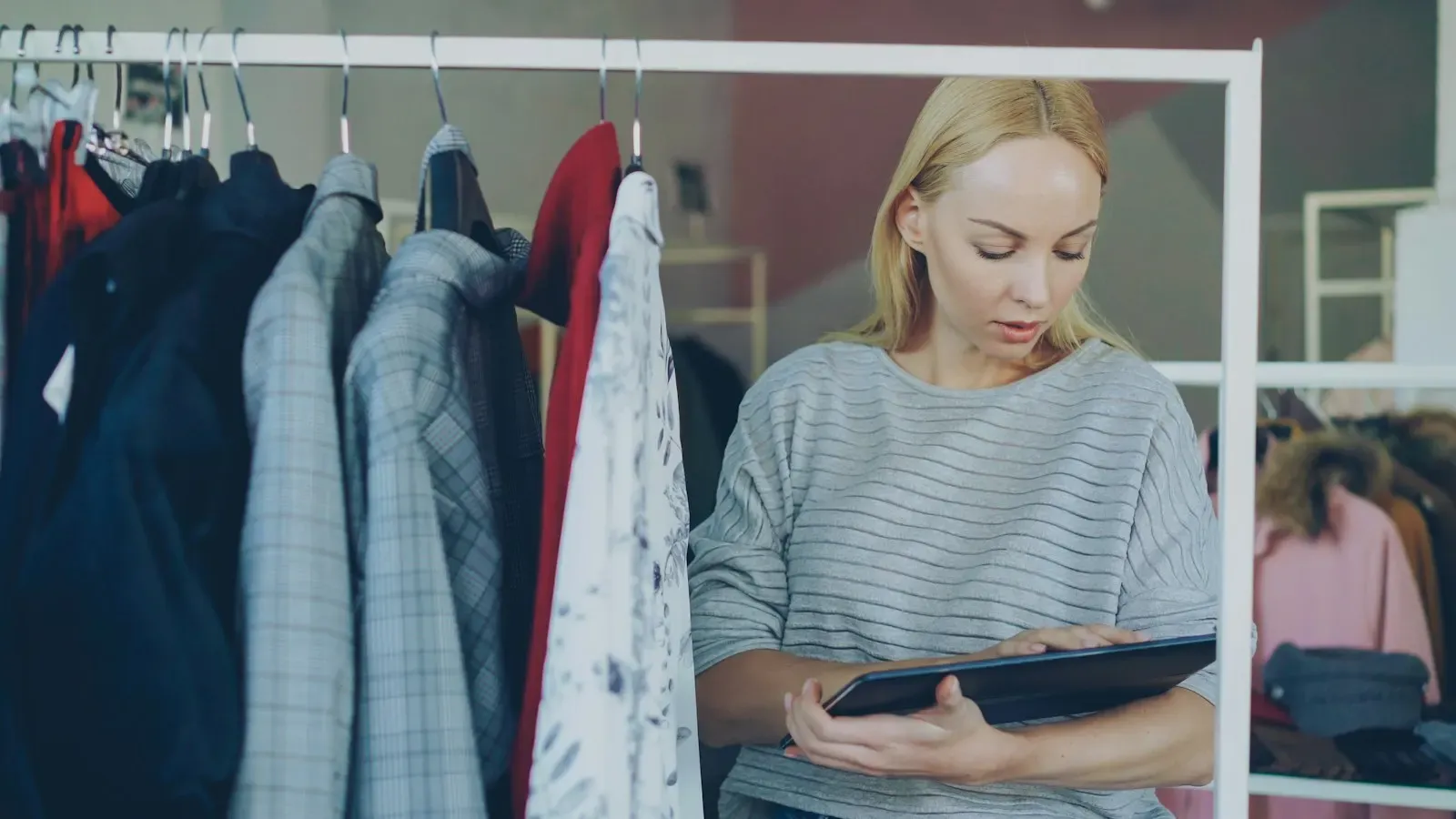 Store owner reading an insight on her tablet