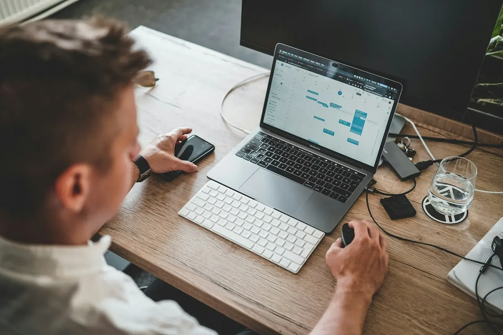 User applying a change in a web app on his laptop