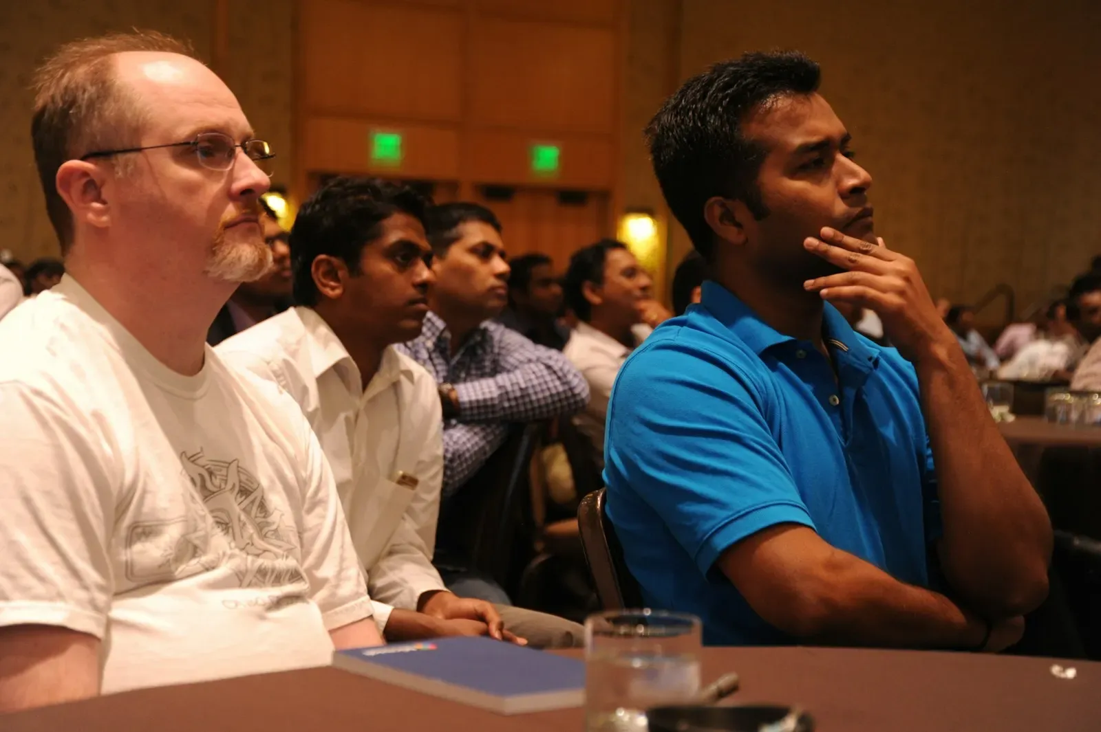 Team watching a product demo in a meeting