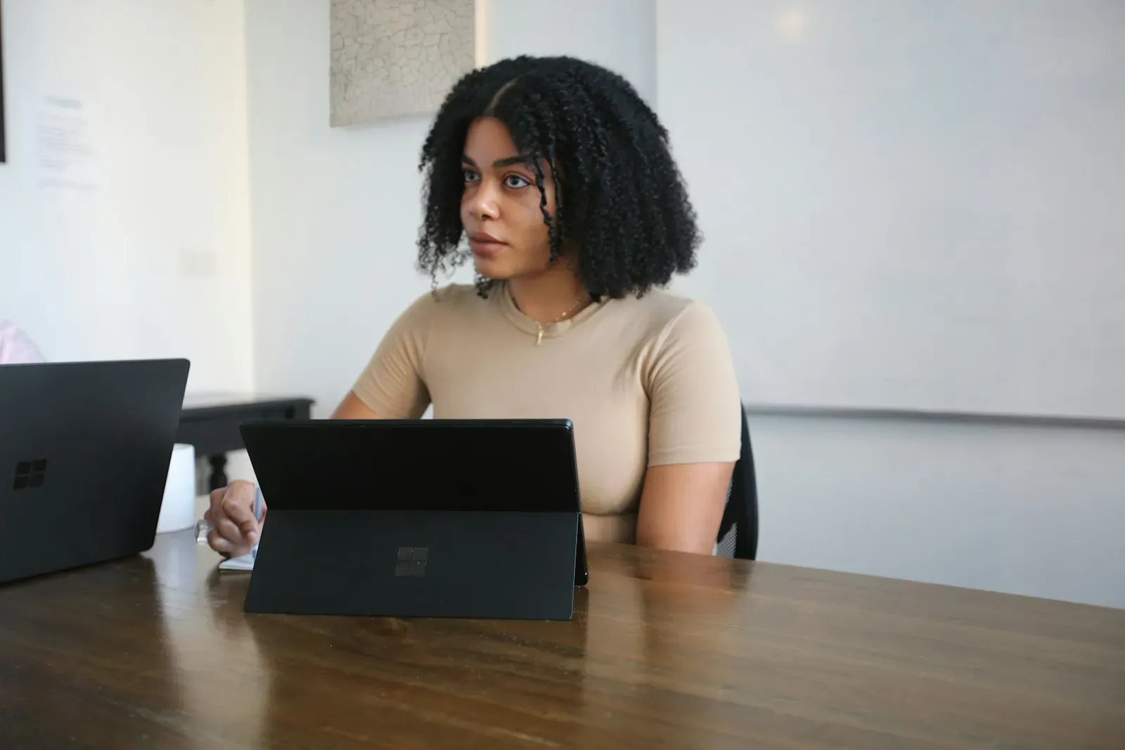 HR specialist working on a tablet in a meeting room