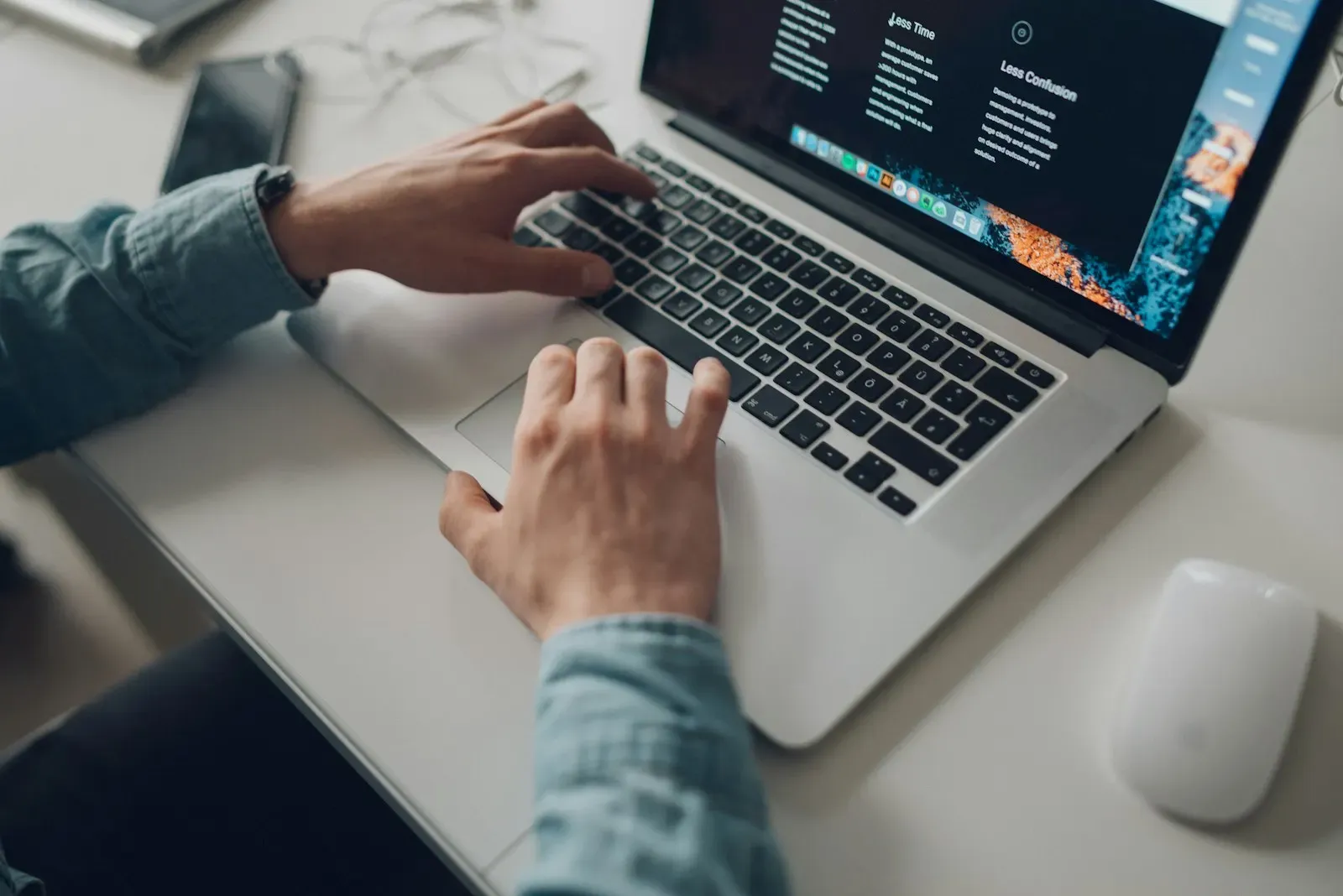 Marketer typing a campaign brief on a laptop