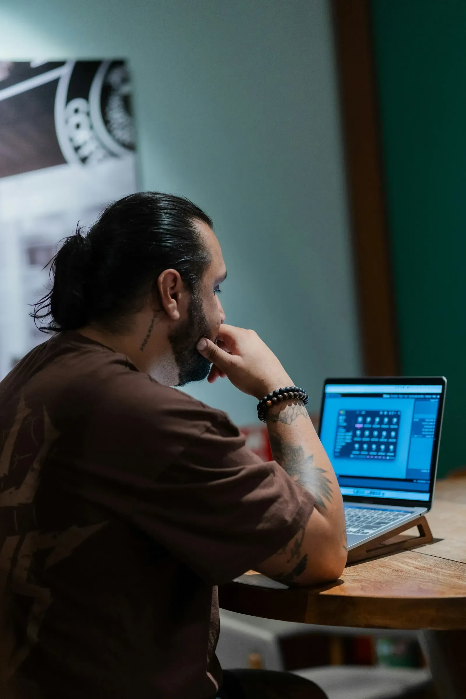Software user working through a product on his laptop