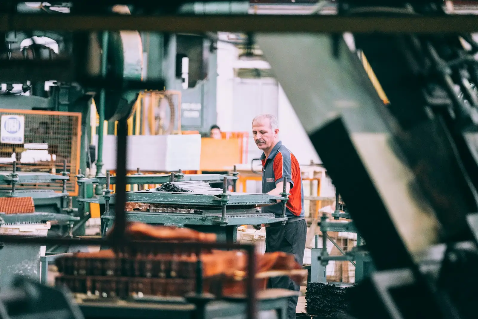 Operator running machinery on a production line