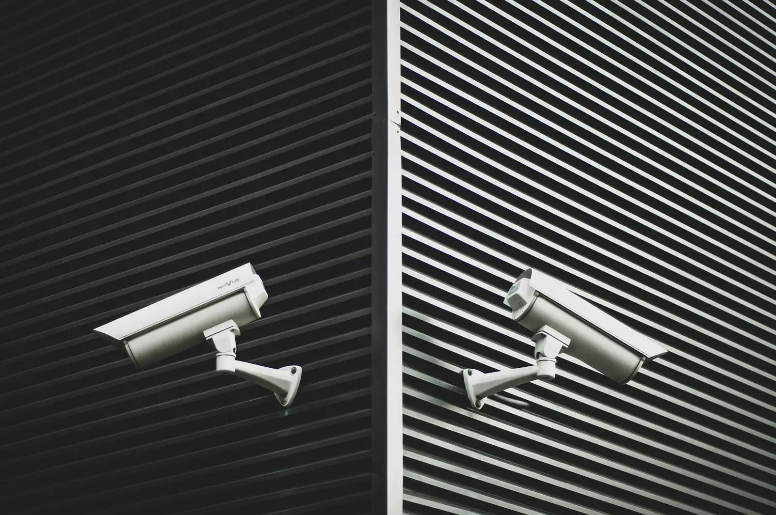 Two CCTV cameras mounted on a wall