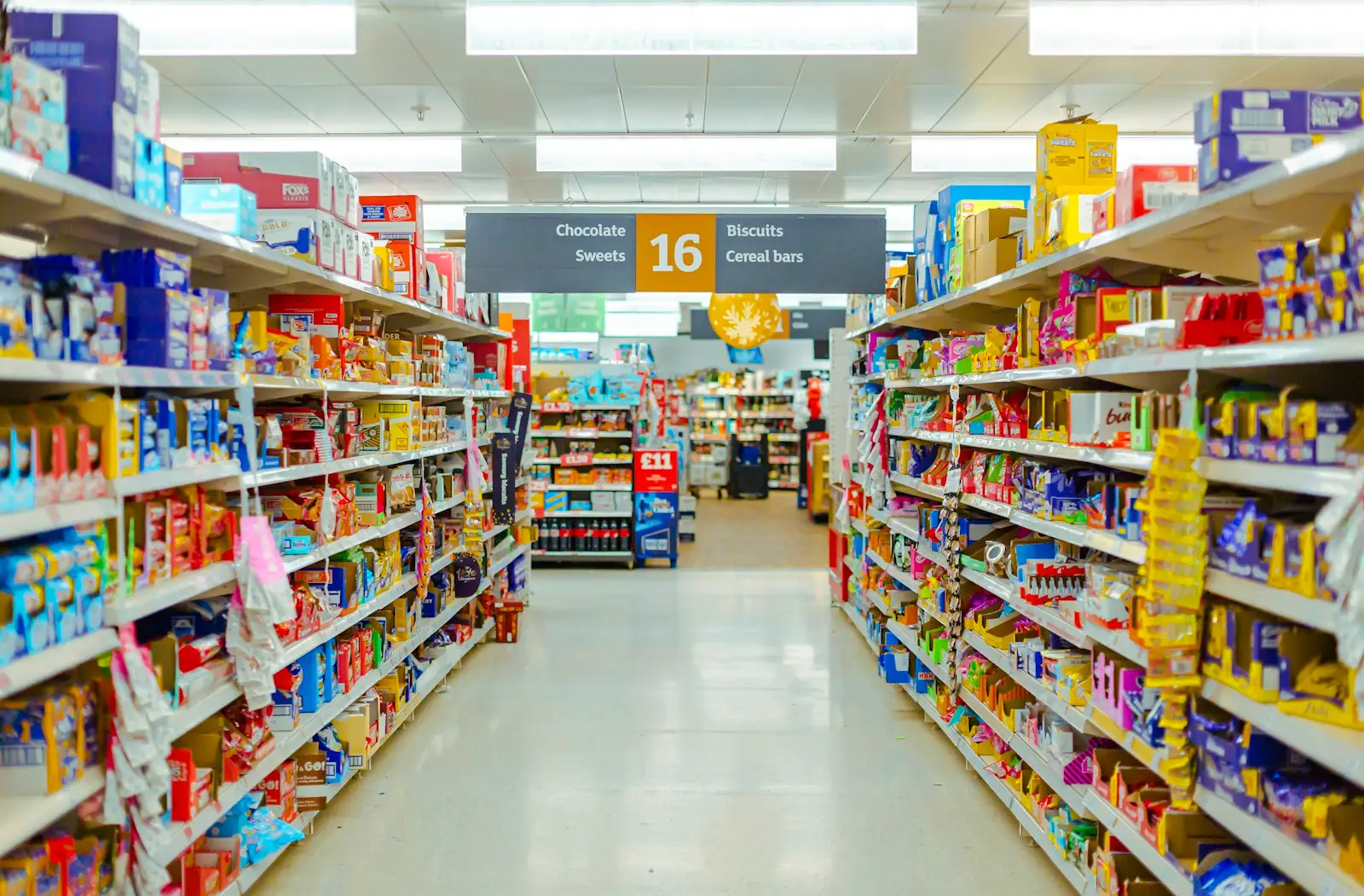 Grocery store aisle stocked with products