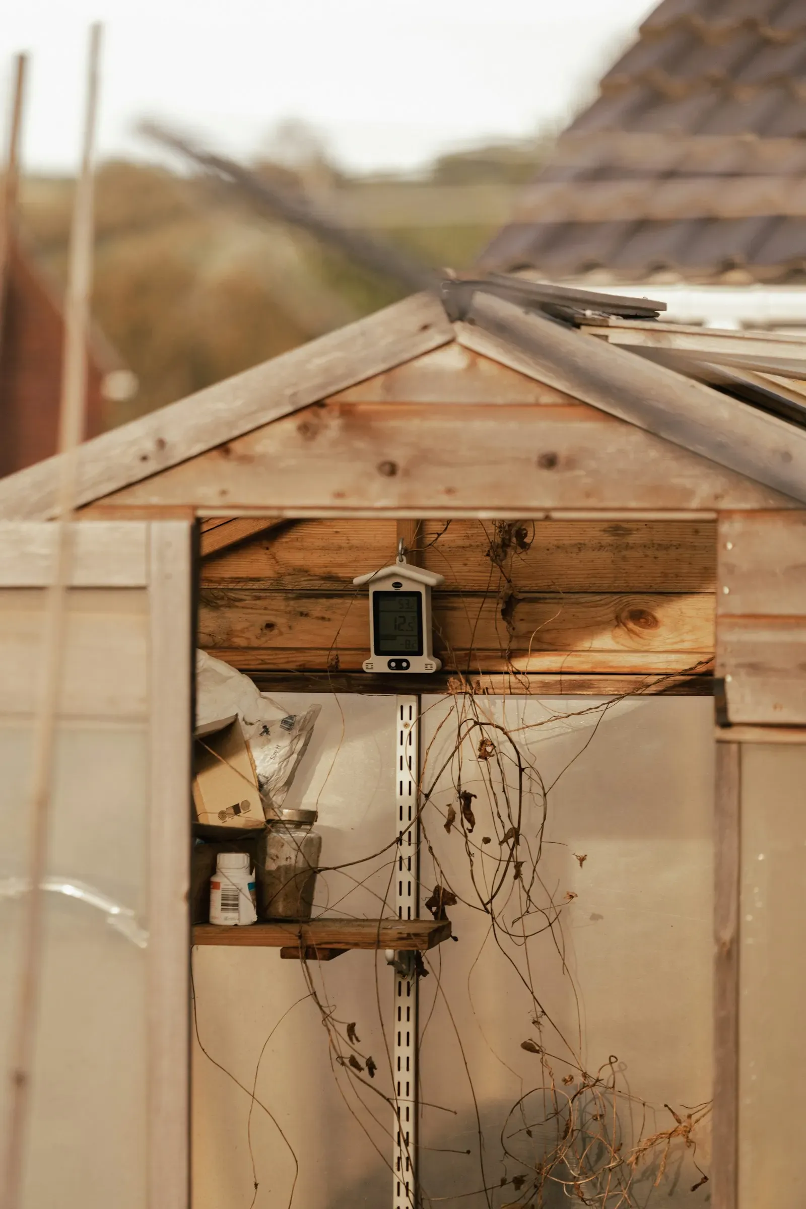 Sensor unit mounted inside a wooden greenhouse
