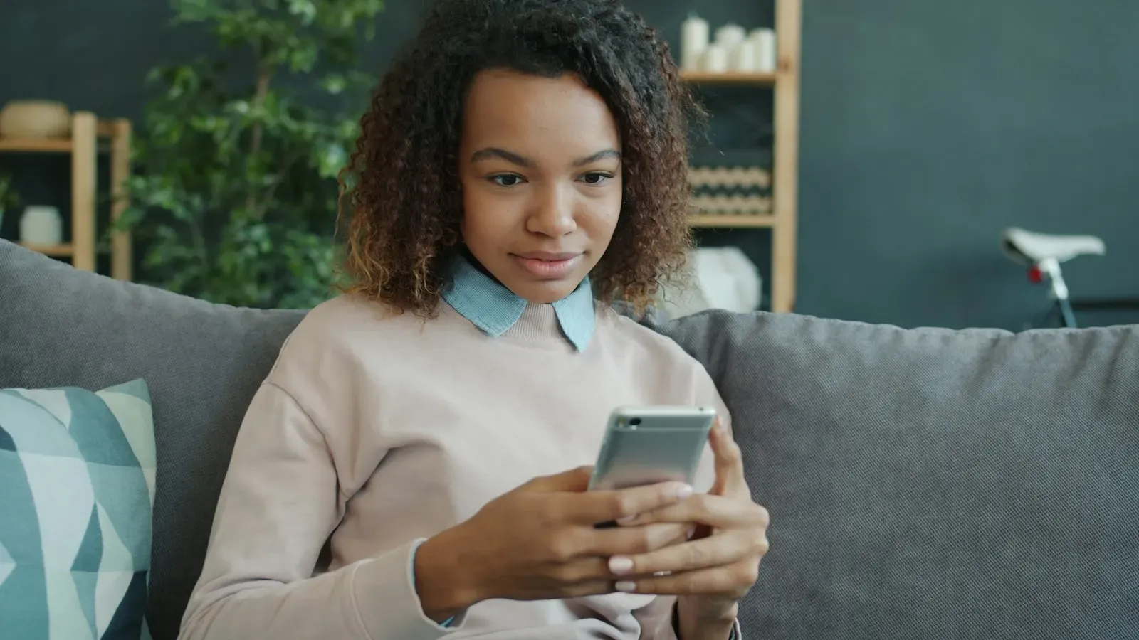 Person checking a connected-home app on a phone