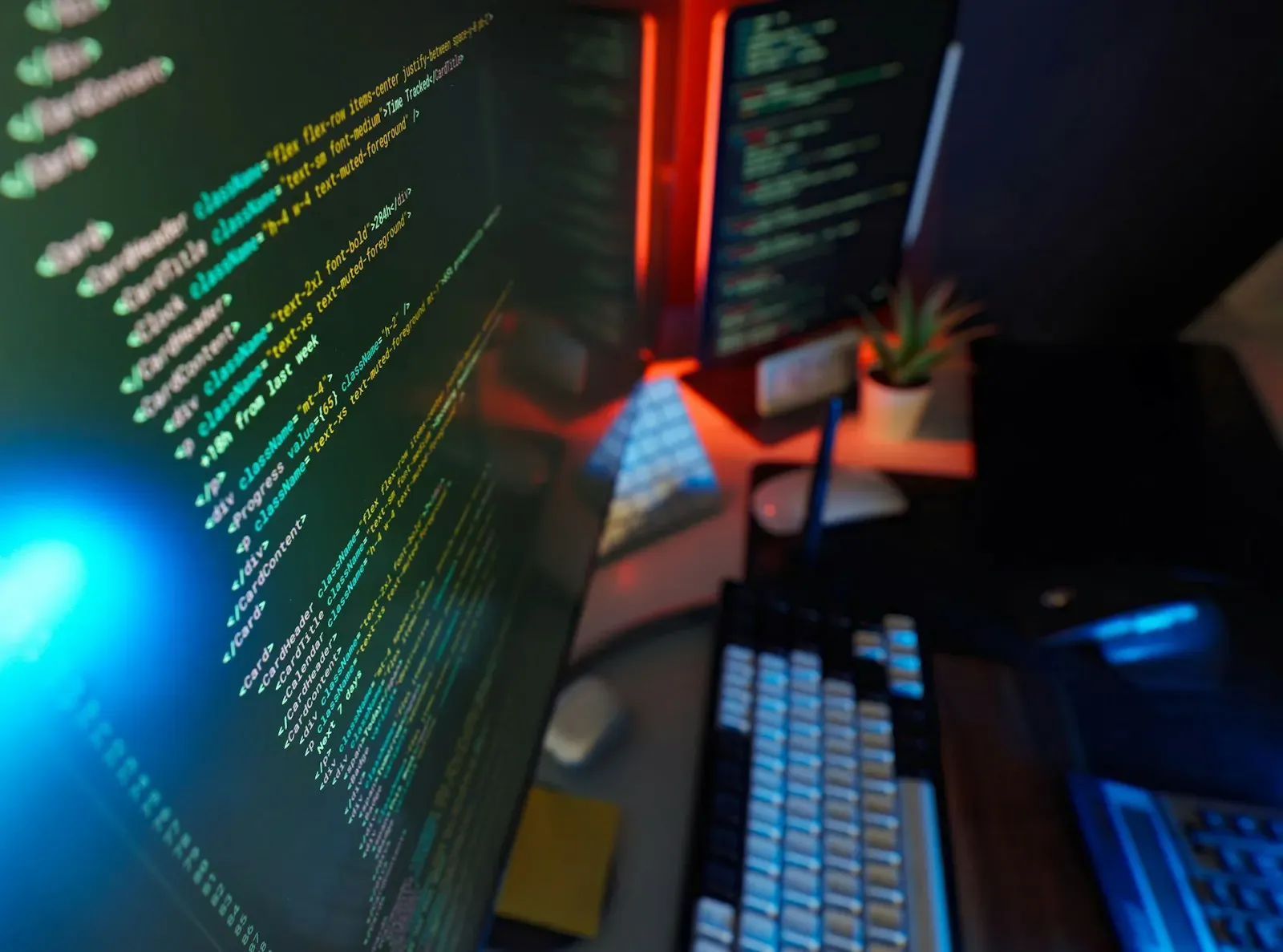 Code on two monitors in a developer's workspace