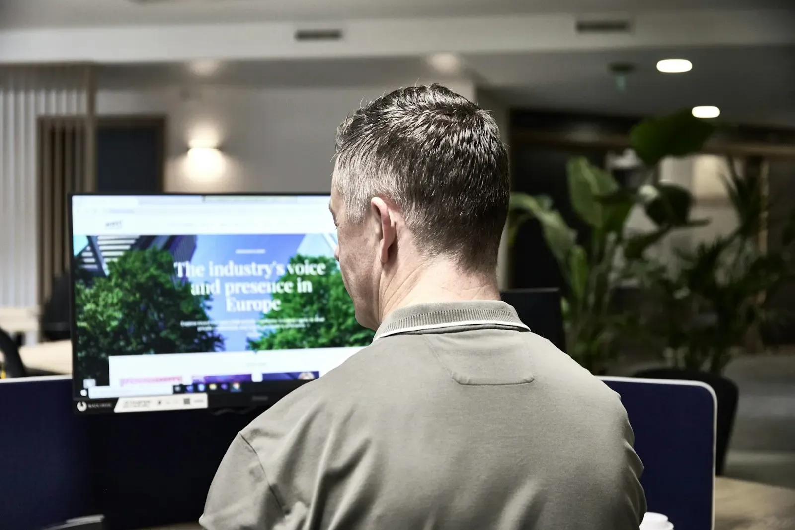 Operations engineer watching a dashboard on his monitor