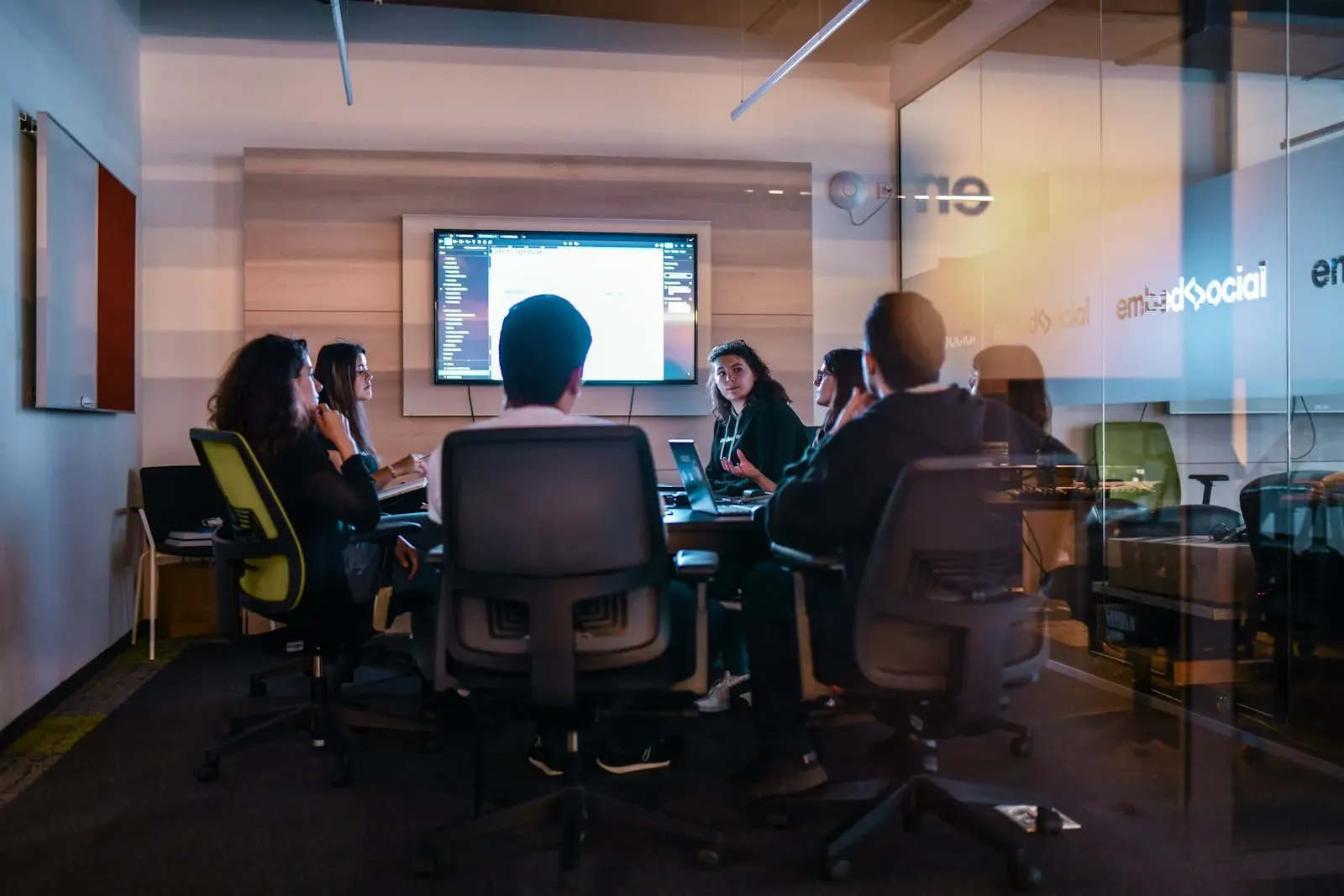 Team presenting a review in a meeting room