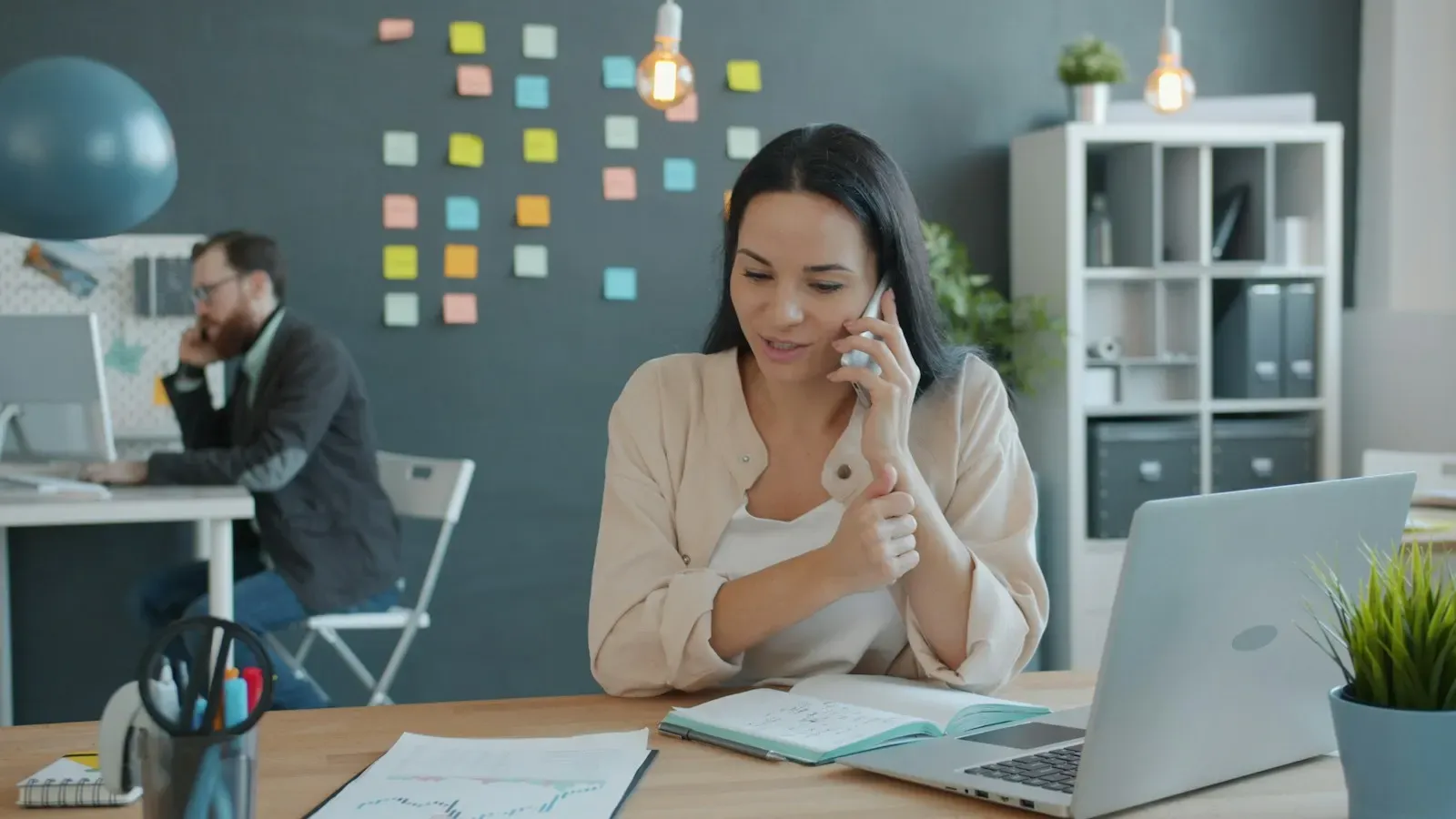 Account manager planning on a call at her laptop