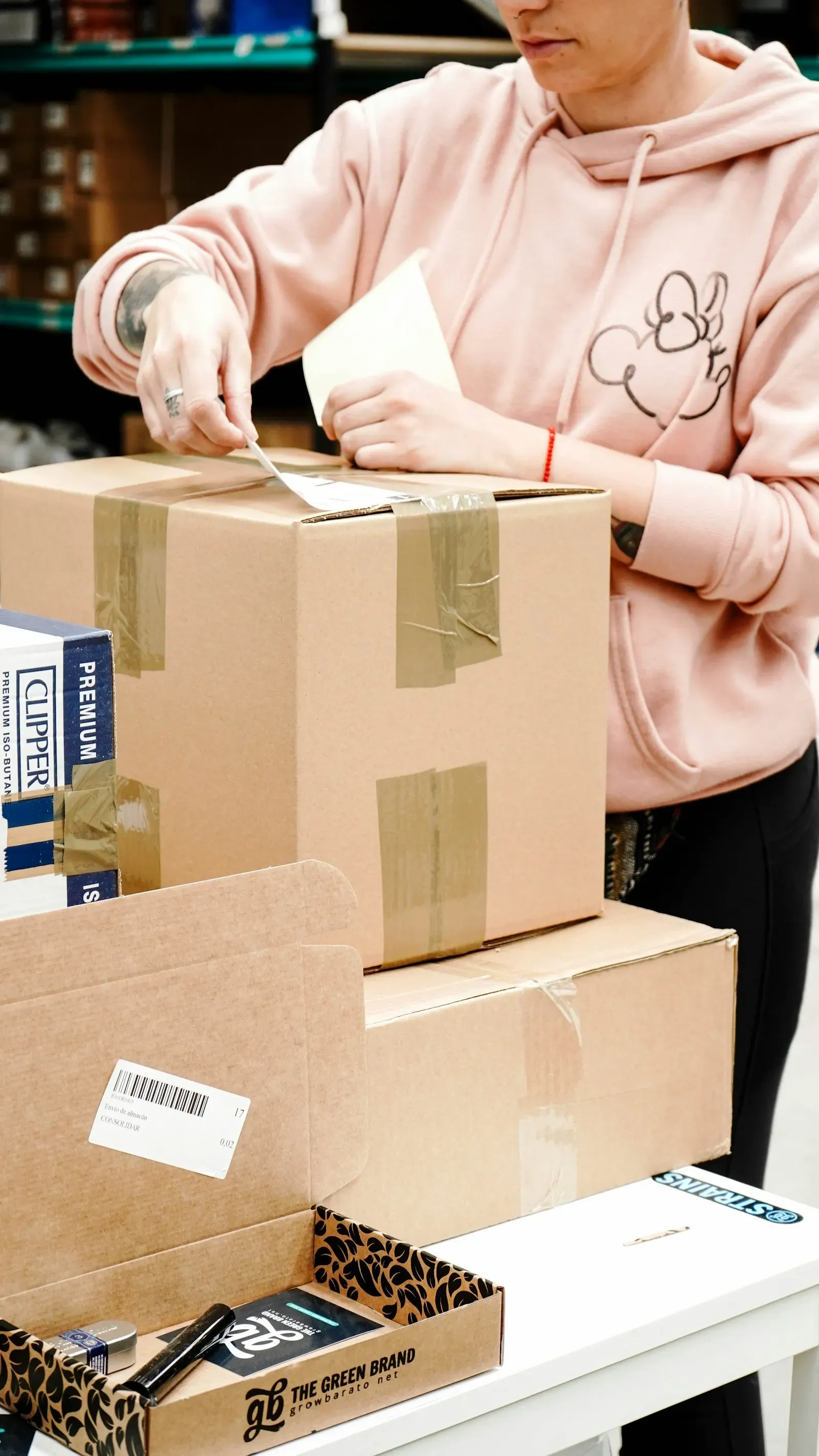 Packer labeling a parcel for shipping