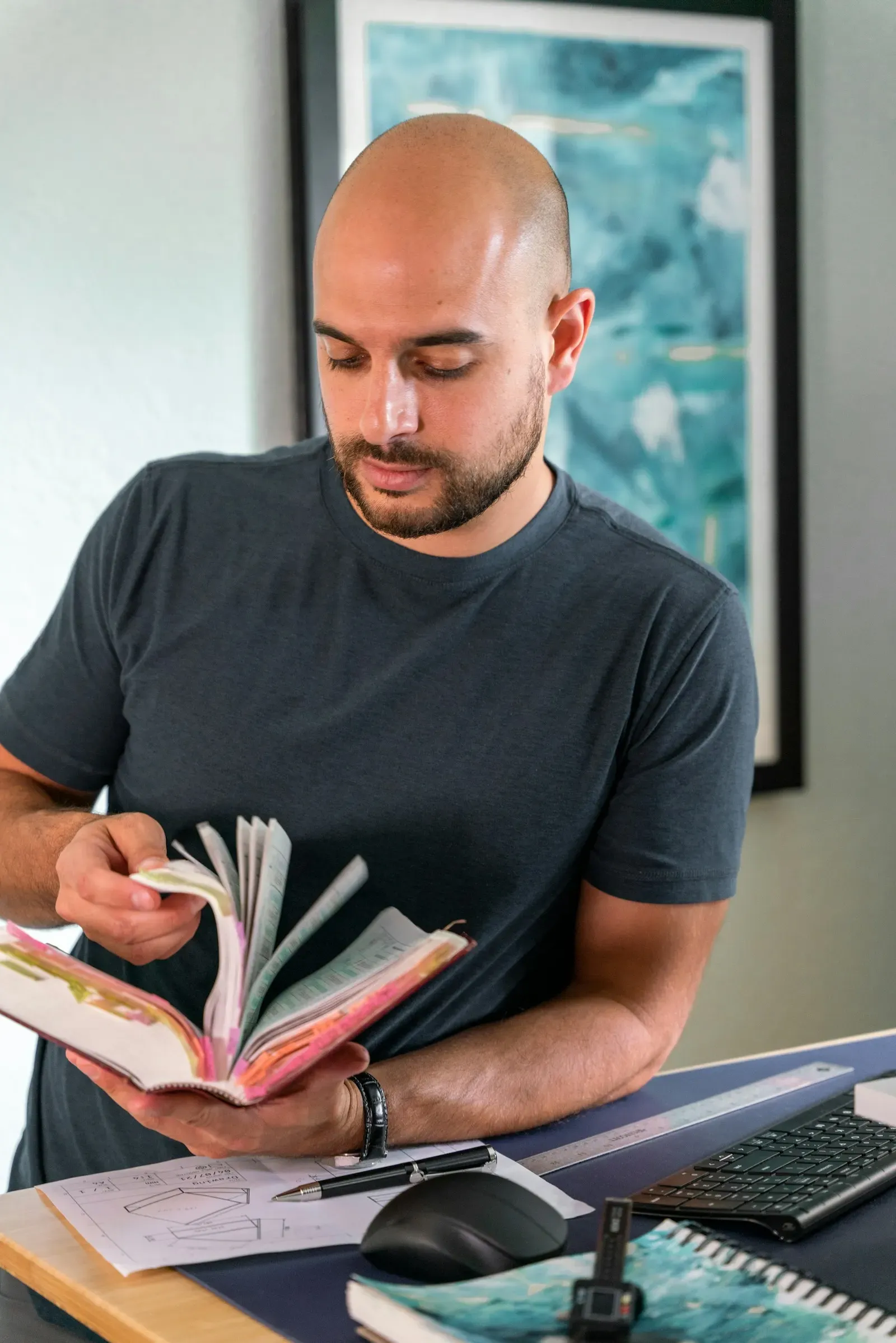 Analyst reading through a report at his desk