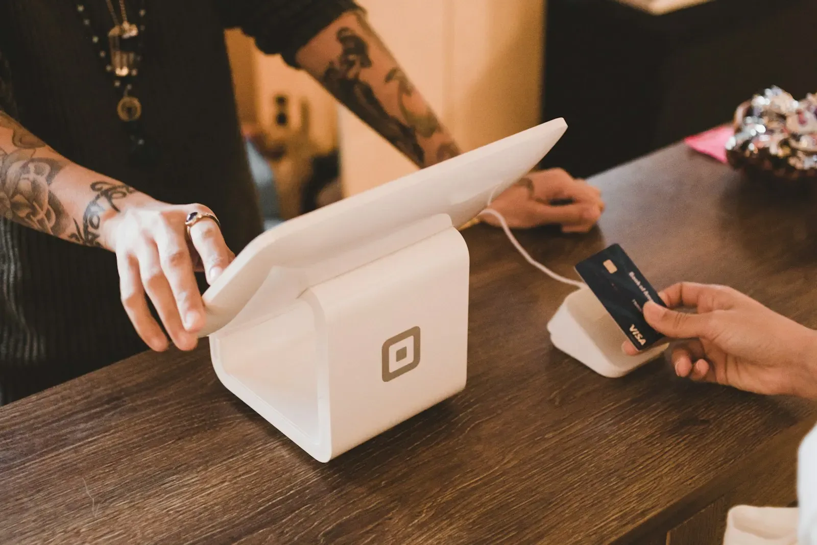 Customer paying by card at a tablet till