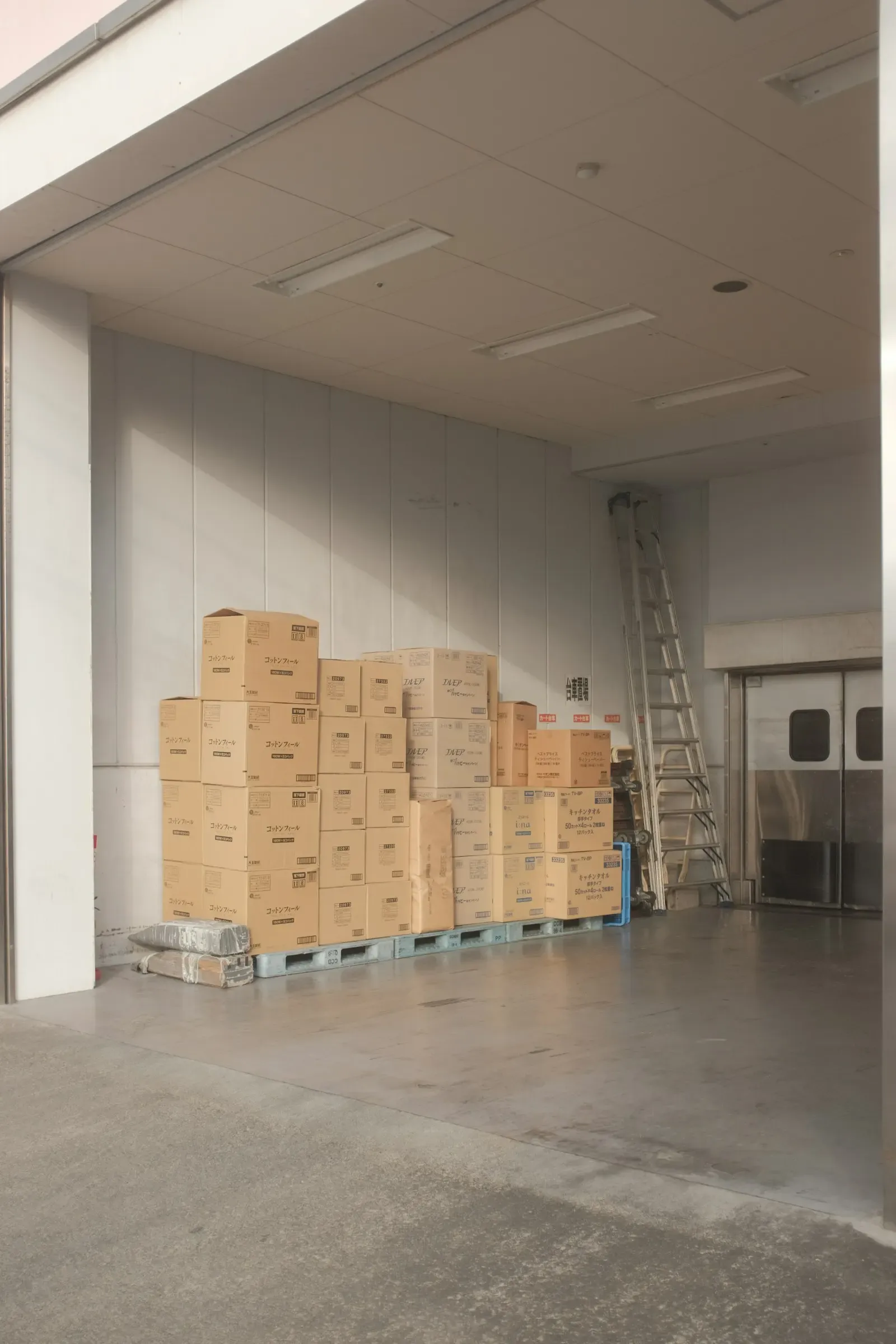 Stacked cardboard boxes in an empty room
