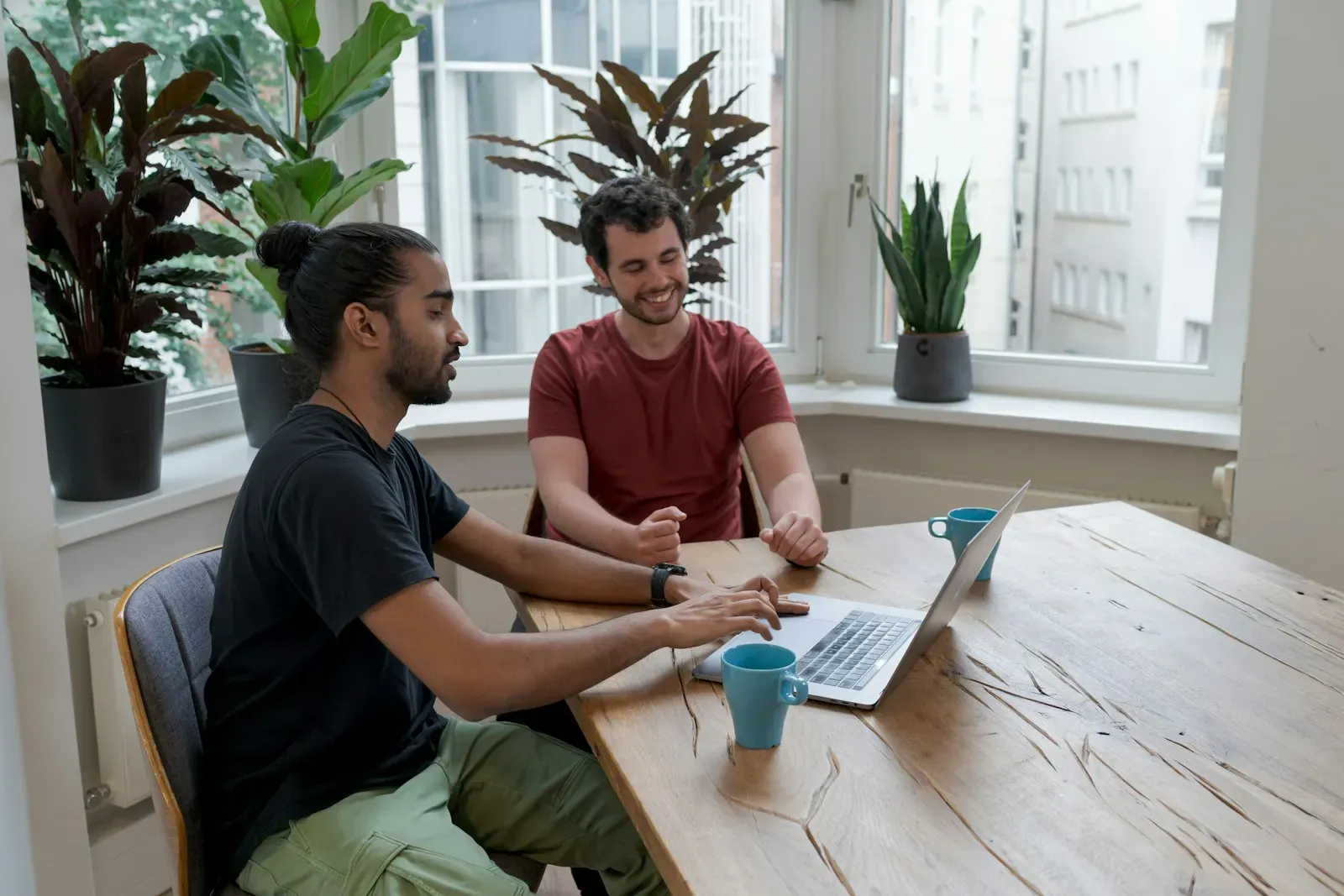 Man and woman working together at a table