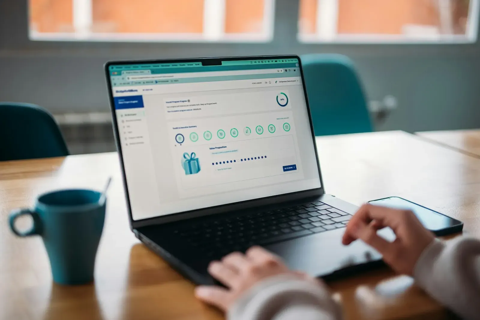 Person reviewing a rewards dashboard on a laptop