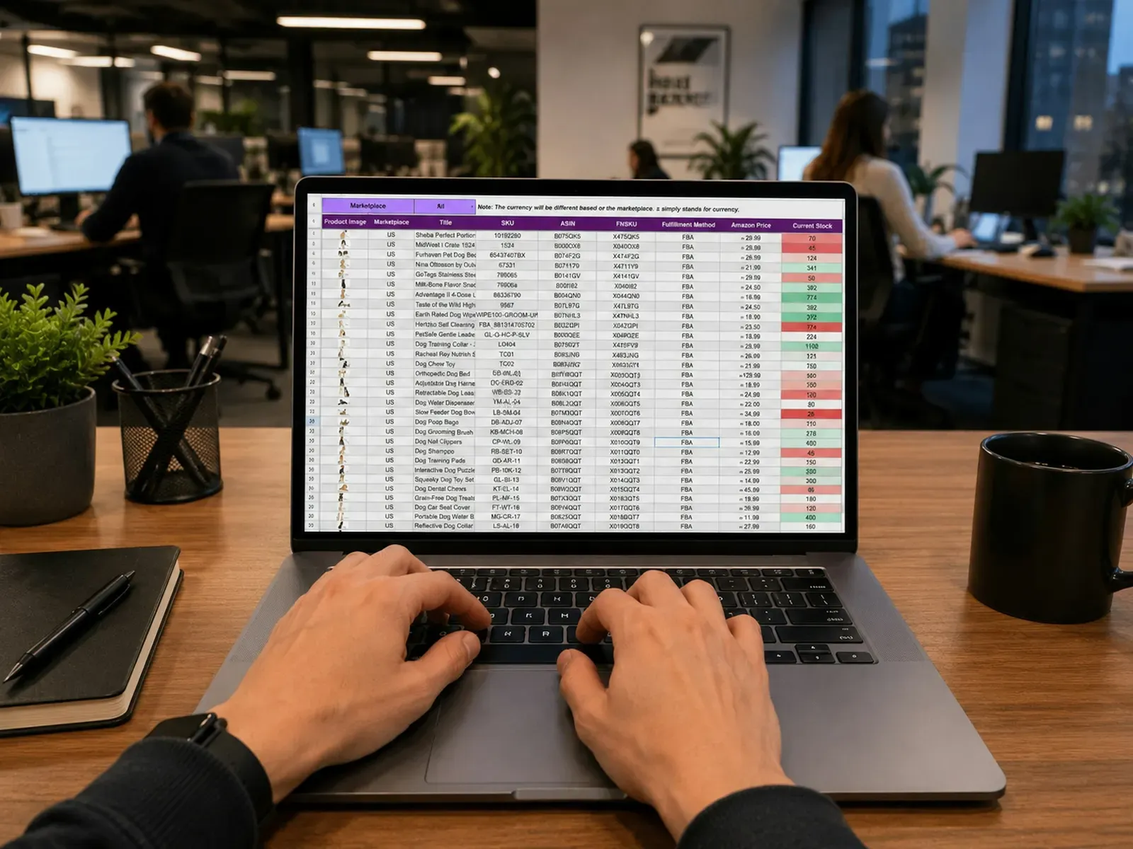 Hands typing on a laptop showing a cost spreadsheet in an office