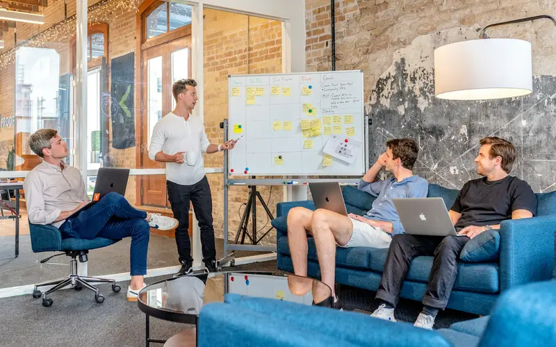 Product team watching a whiteboard planning session